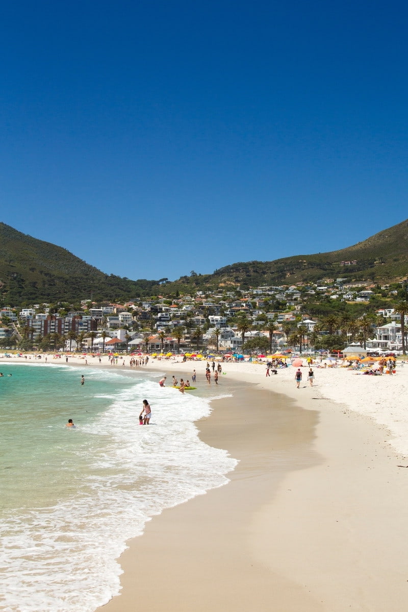 Camps Bay, in Cape Town, lies at the foot of Lion's Head. Its waters are icy and a welcome respite for baking beachgoers