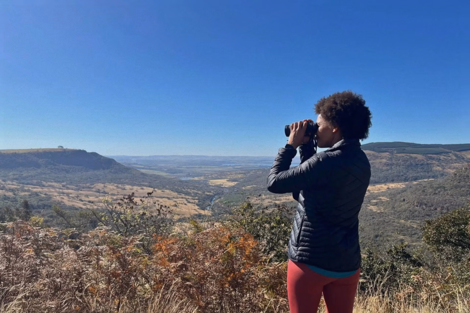 Cindy-Lee Cloete, CEO of WESSA, observing wildlife in a natural setting in South Africa