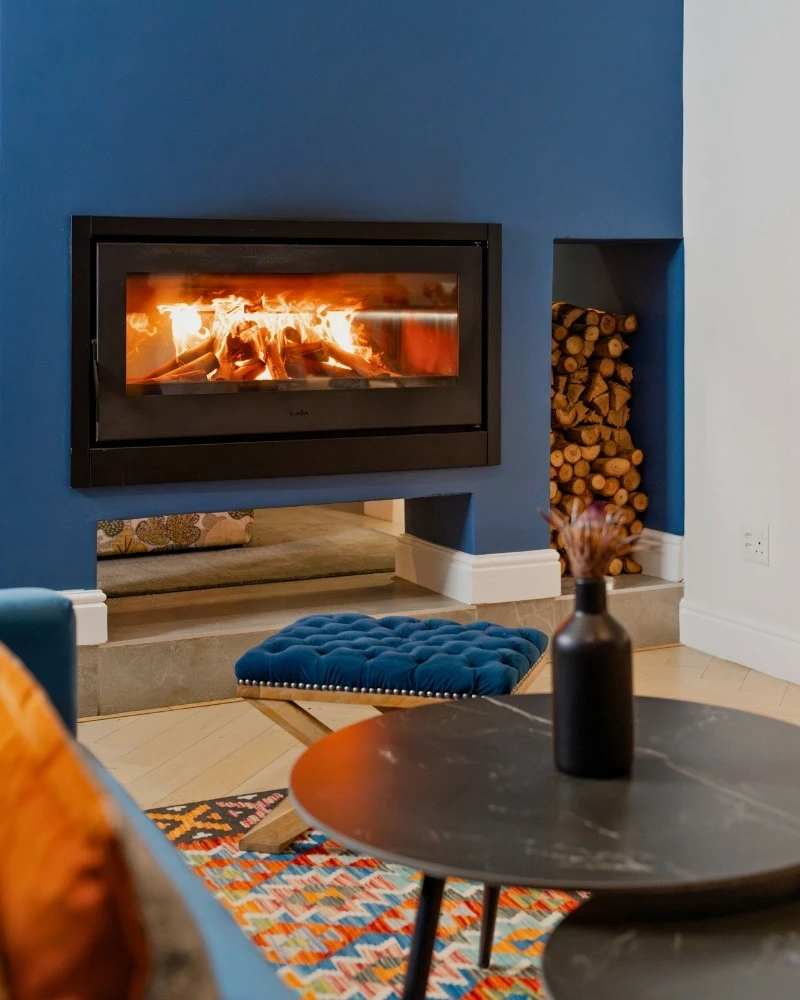 The modern, double-sided fireplace in the bar at One Marine Drive Boutique Hotel.