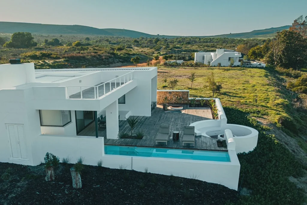 Aerial view of a Veldt Haus cottage at De Wildeveldt, surrounded by green veld on South Africa's West Coast