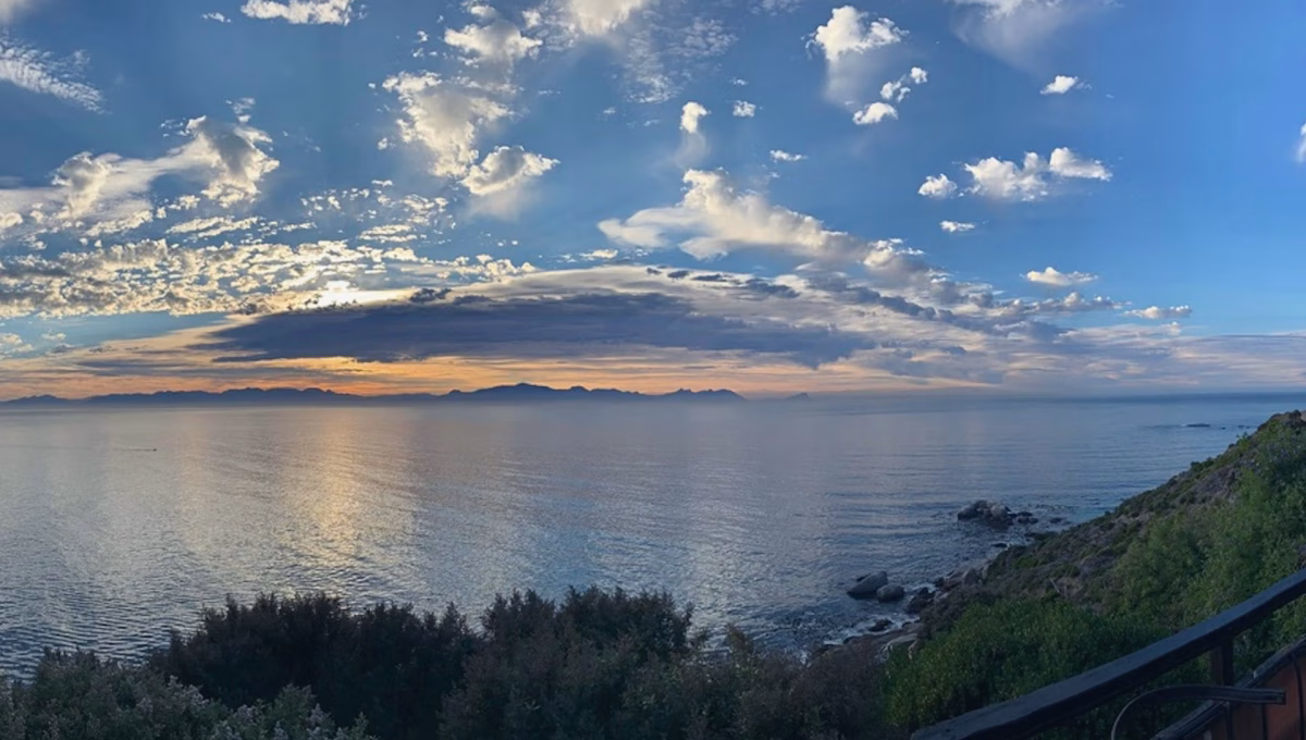 Indian Ocean view from eco-cabin at Cape Point Mountain Getaway, Western Cape, with Hottentots-Holland Mountains in the background
